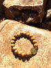 Imagen de Pulsera una década San Benito con medalla dorada